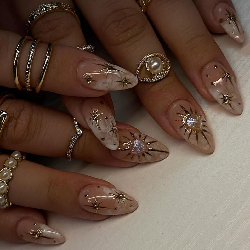 Luxury Nude Gold Almond Nails | Shimmer Gold & Star Fake Nails | Elegant Astrology Nail Art | Ethereal Sun Short Press On Nails